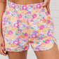 Short d'athlétisme taille haute à motif floral rétro orange