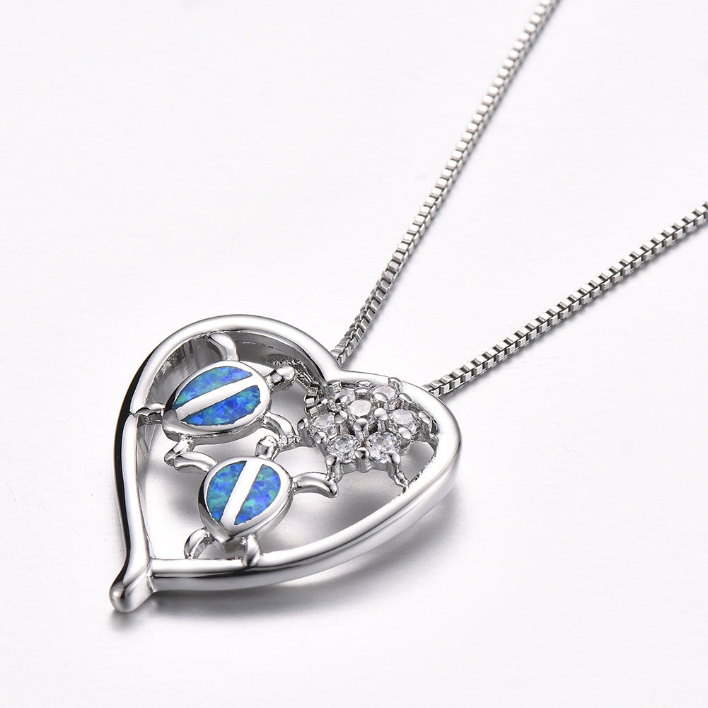 Collier pendentif tortue en or blanc