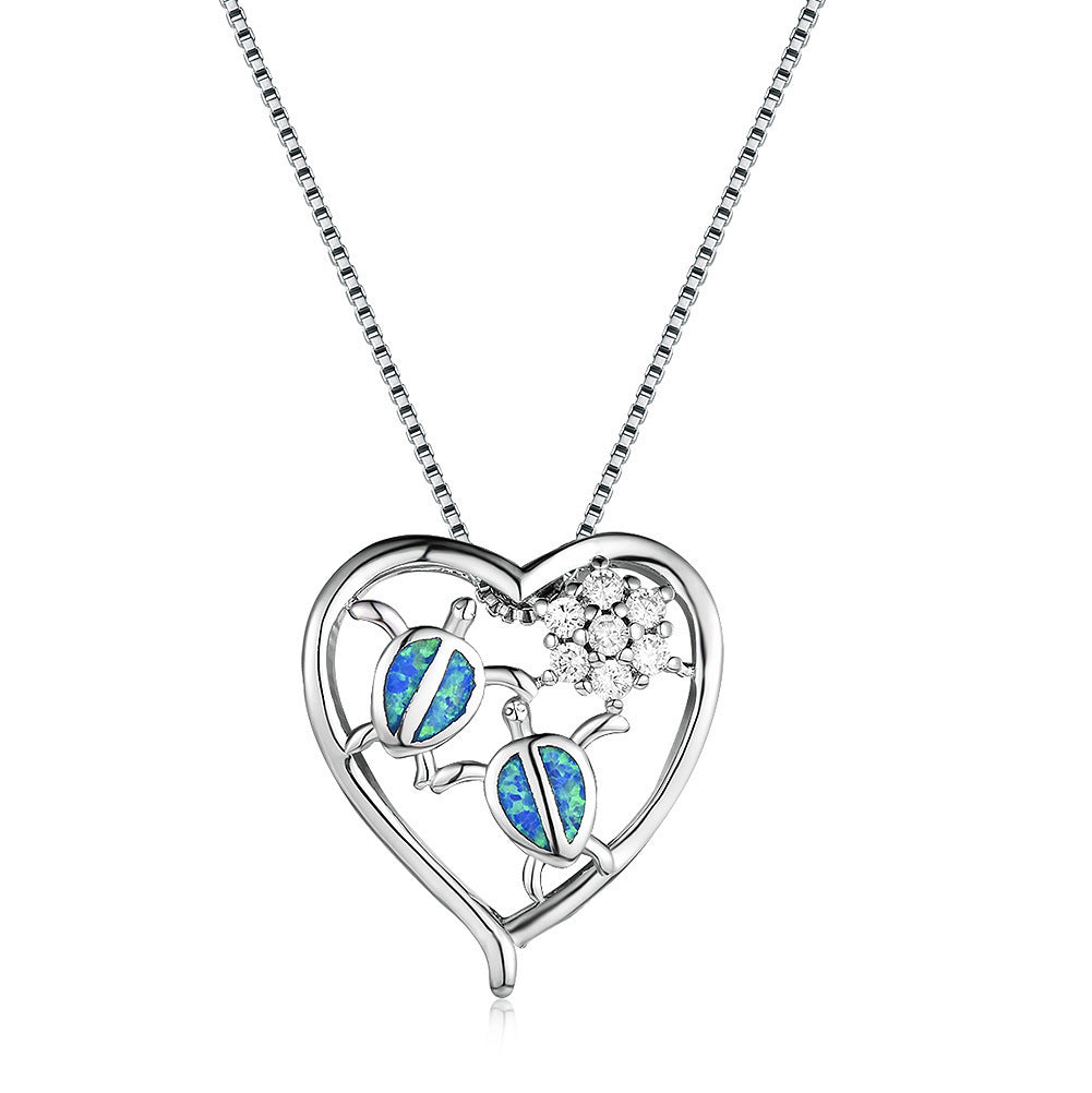 Collier pendentif tortue en or blanc