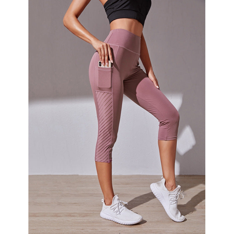 Legging de sport court à coupe cintrée de poche