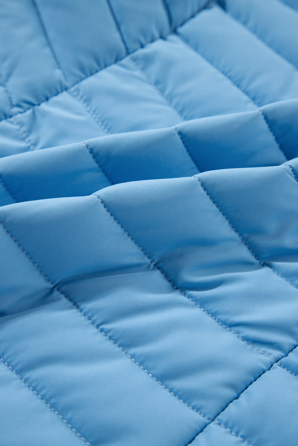 Gilet polaire bleu ciel à col en peluche matelassé et zippé