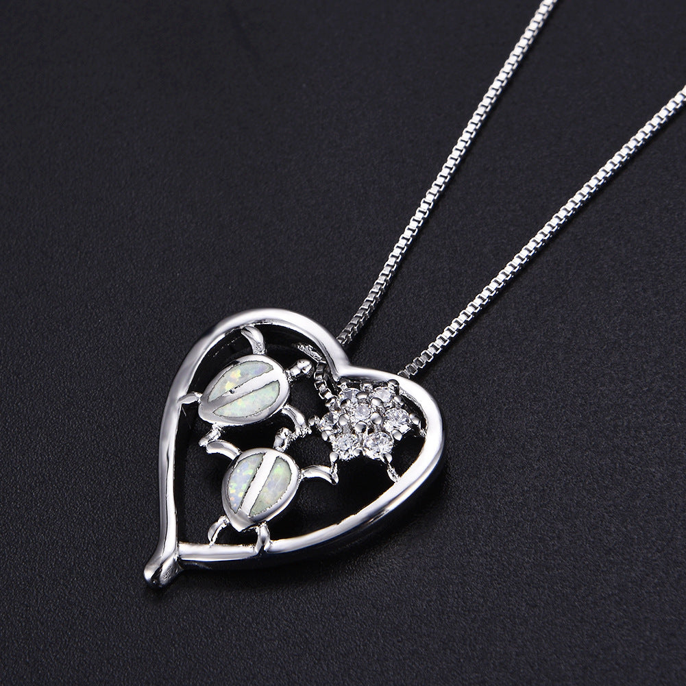 Collier pendentif tortue en or blanc