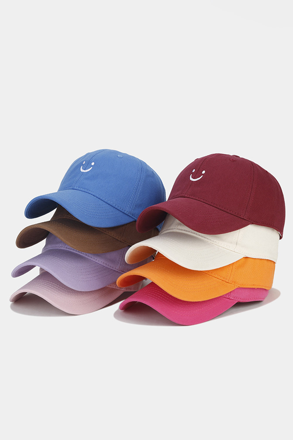 Casquette de baseball à bords arrondis, brodée d'un visage souriant, rouge rosé