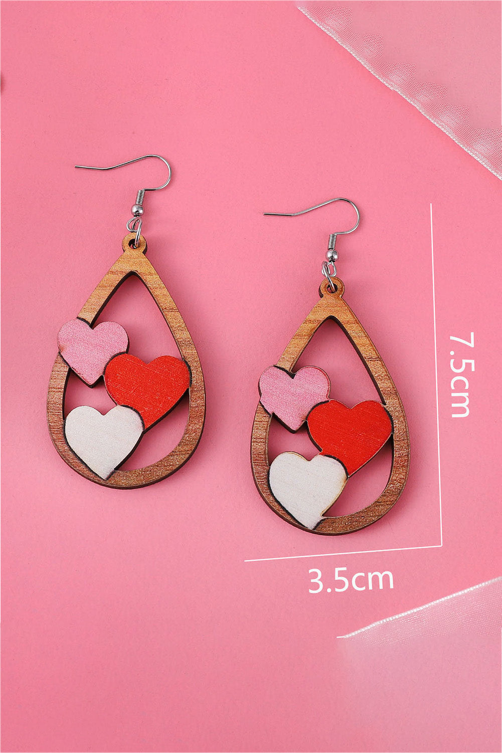 Boucles d'oreilles gouttes d'eau avec insertion de 3 coeurs pour la Saint-Valentin