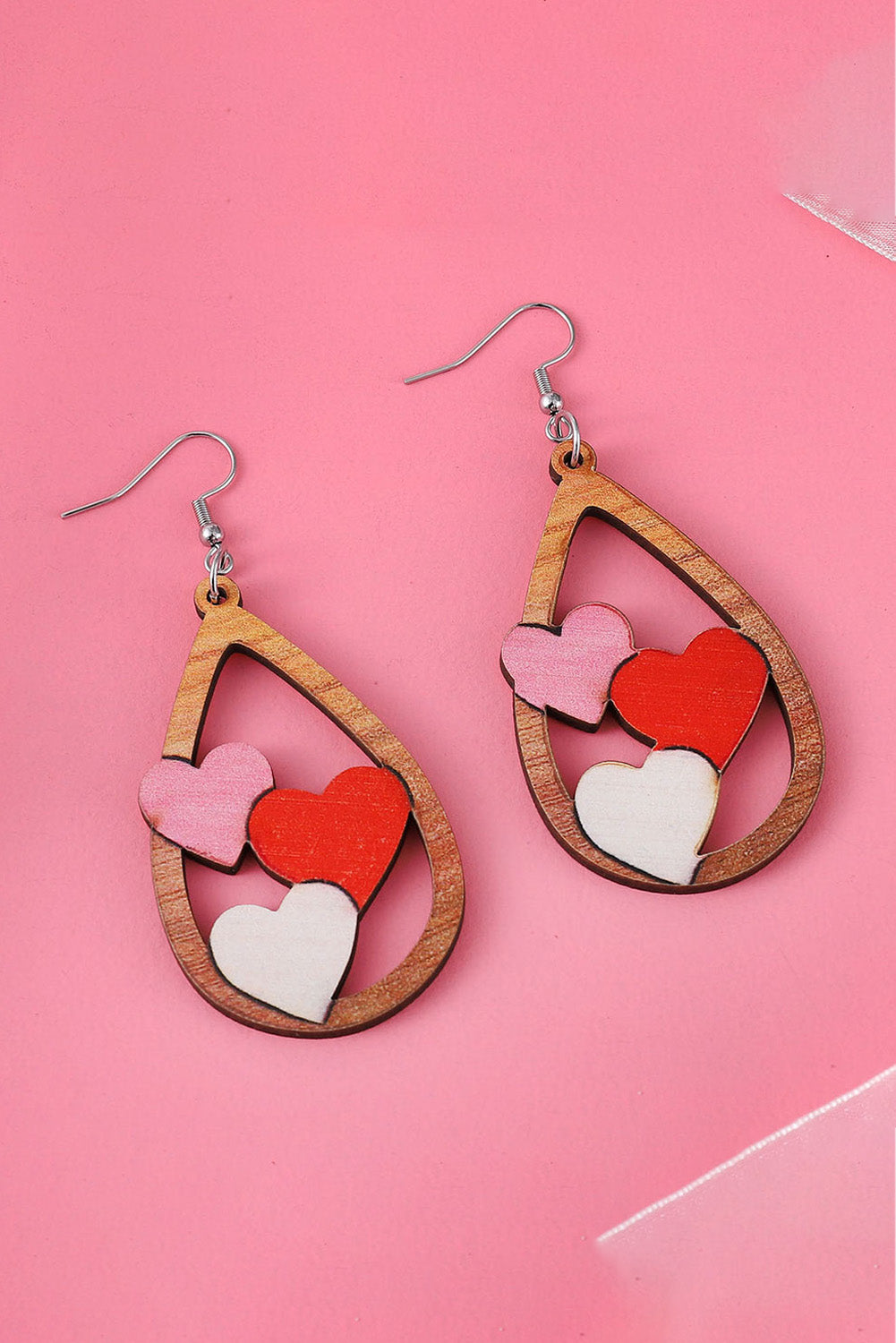 Boucles d'oreilles gouttes d'eau avec insertion de 3 coeurs pour la Saint-Valentin