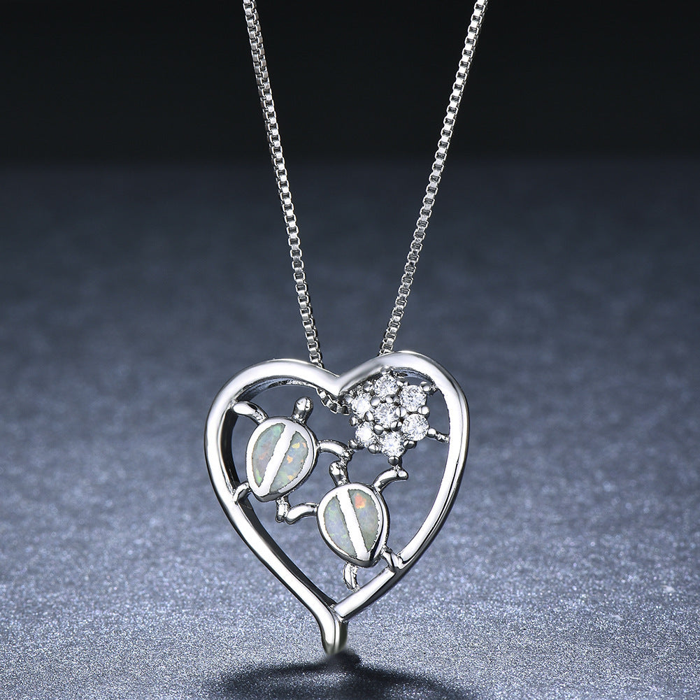 Collier pendentif tortue en or blanc