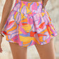 Short évasé à taille smockée imprimé abstrait violet
