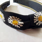 Bandeau à gros nœud en tricot avec marguerite