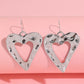 Boucles d'oreilles pendantes en forme de cœur creusé de la Saint-Valentin blanche