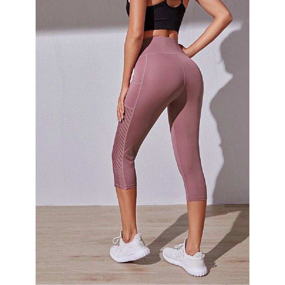 Legging de sport court à coupe cintrée de poche