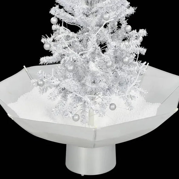 Décoration de noël. Arbre de Noël neigeux avec base de parapluie blanc