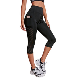 Legging de sport court à coupe cintrée de poche