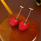 Boucles d'oreilles design à la mode avec fraises rouges