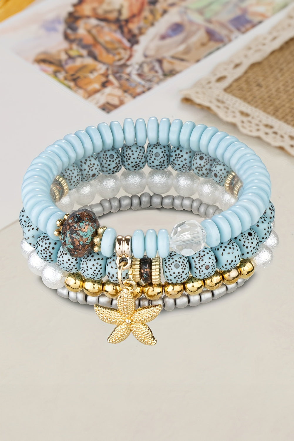 Lot de 4 bracelets perlés avec pendentif étoile de mer bleu clair