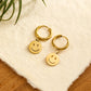 Boucles d'oreilles pendantes en alliage d'or avec visage souriant