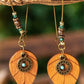 Boucles d'oreilles pendantes en forme de feuille avec décor en or et turquoise du désert