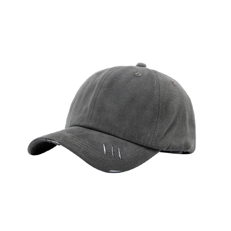 Casquette de baseball à visière incurvée et déchirée