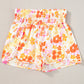 Short d'athlétisme taille haute à motif floral rétro orange