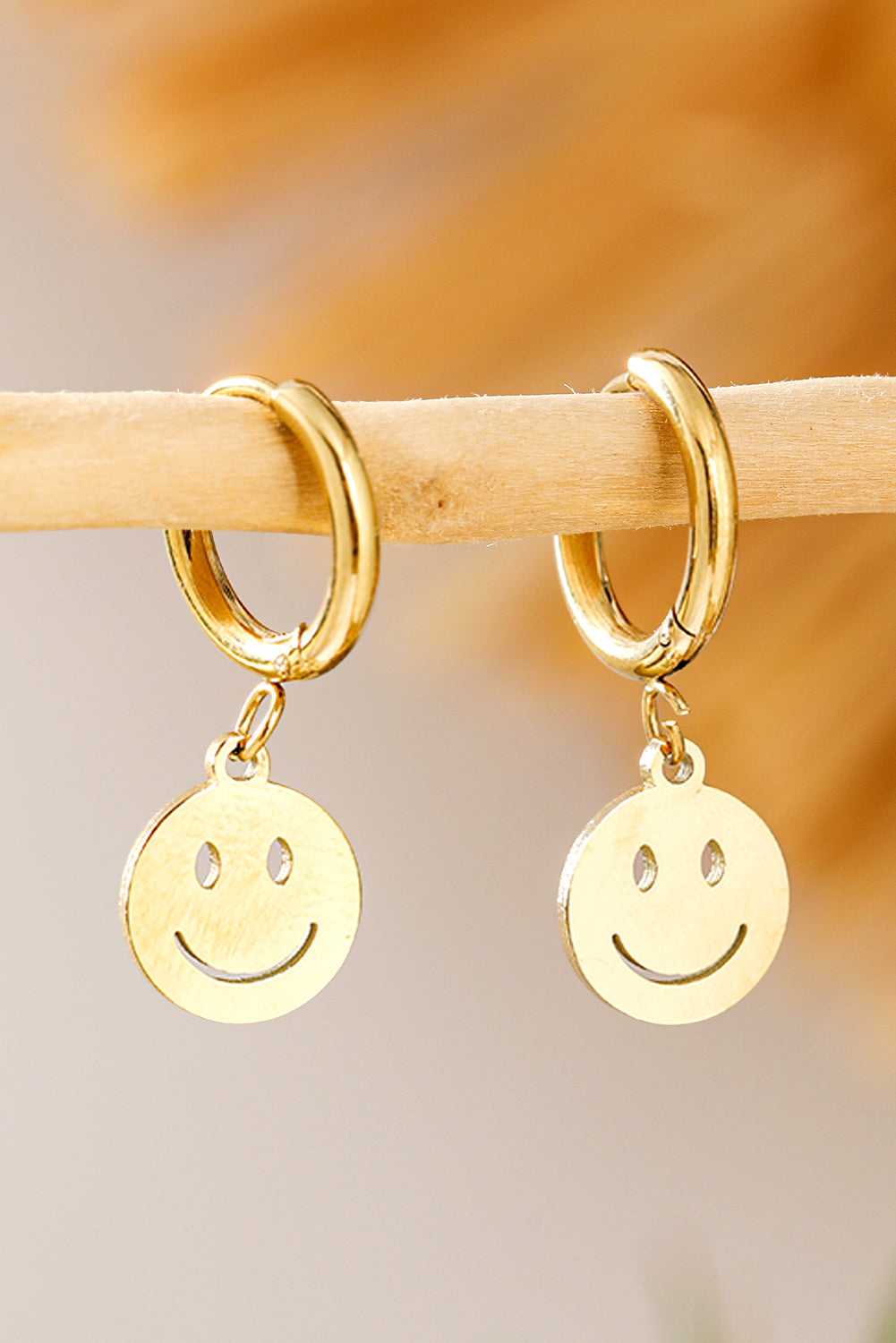 Boucles d'oreilles pendantes en alliage d'or avec visage souriant