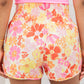 Short d'athlétisme taille haute à motif floral rétro orange