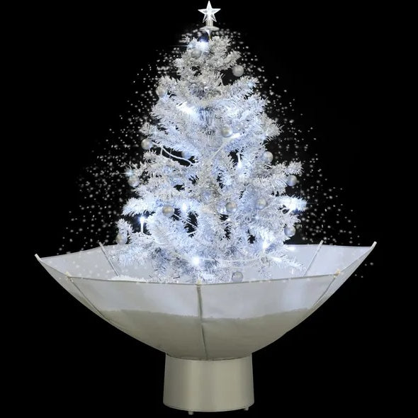 Décoration de noël. Arbre de Noël neigeux avec base de parapluie blanc