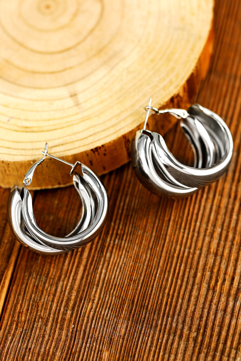 Boucles d'oreilles pendantes argentées à anneaux superposés