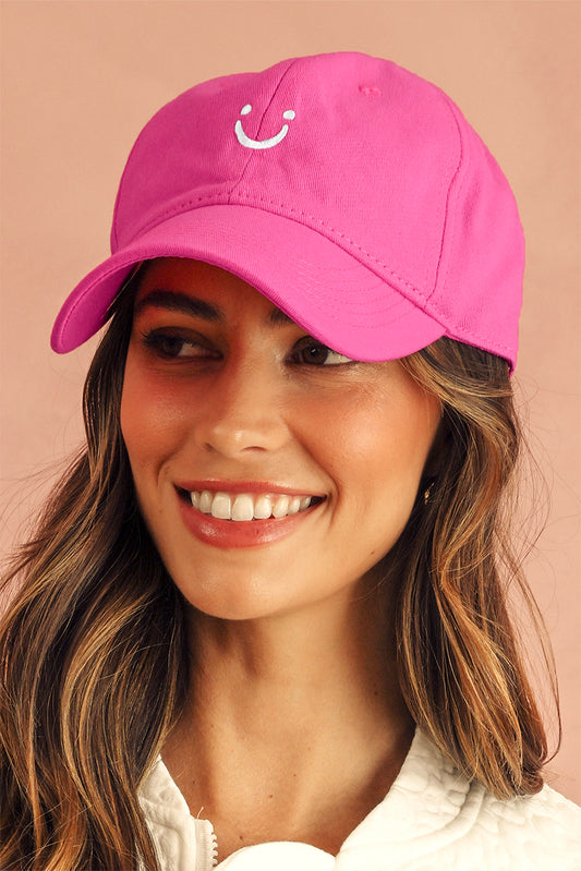 Casquette de baseball à bords arrondis, brodée d'un visage souriant, rouge rosé