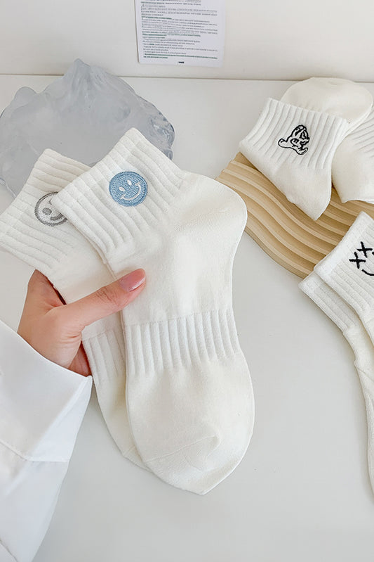 Chaussettes en coton brodées d'un joli visage souriant, bleu clair